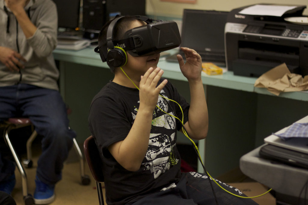 Child wearing VR goggles