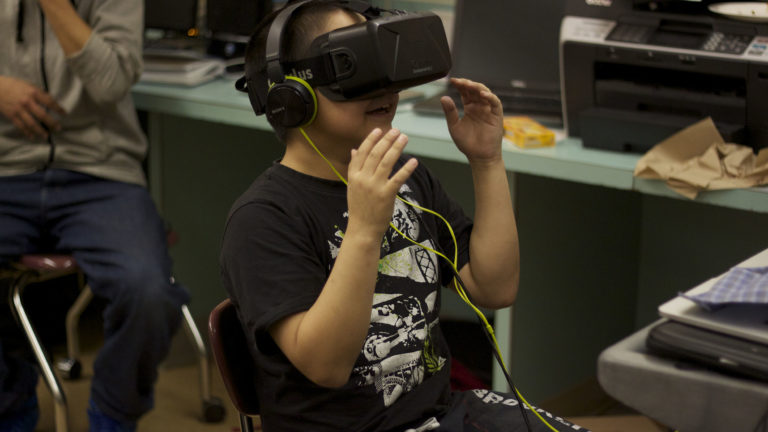Child wearing VR goggles