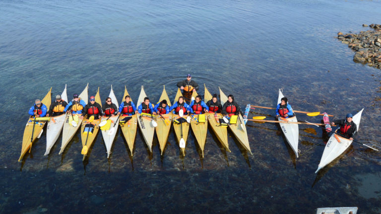 youth in kayaks