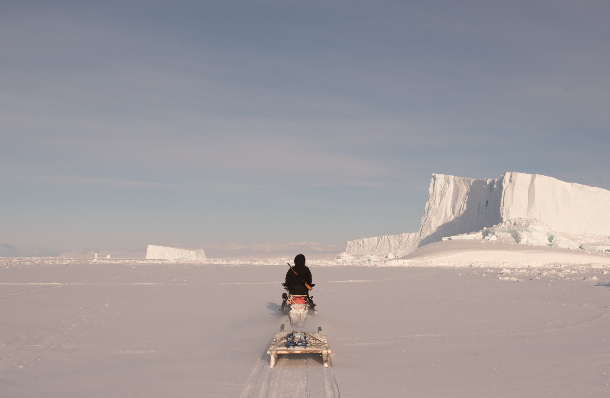 person with sled in the snow